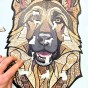 Complete set of wooden puzzles German Shepherd - assembled picture, box, and special pieces.